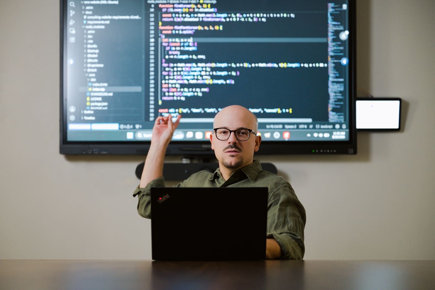 E. Rodriguez reviewing code with a client team